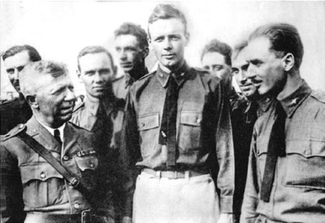 Captain Charles A. Lindbergh, Missouri National Guard, and members of his National Guard unit, 110th Observation Squadron, after he flew solo across t