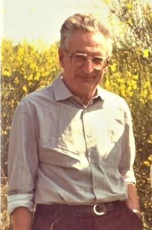 A middle-aged man stood in scrubland