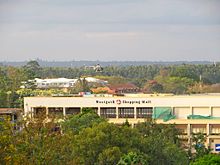 A Kenyan military MD 500 Defender helicopter hovers over the Westgate mall, 23 September Military helicopter hovering over Westgate shopping mall.jpg