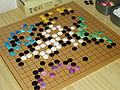 Go game played with stones of different colors.