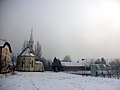 Muzslya a templommal és a plébánialakkal