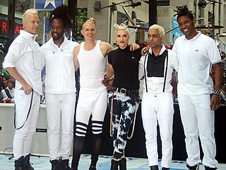No Doubt is an American rock band from Anaheim, California, formed in 1986. For most of their career, the band has consisted of vocalist Gwen Stefani, guitarist Tom Dumont, bassist Tony Kanal, and drummer Adrian Young. Since the mid-1990s, they were supported by trombonist and keyboardist Gabrial McNair and trumpeter and keyboardist Stephen Bradley in live performances.