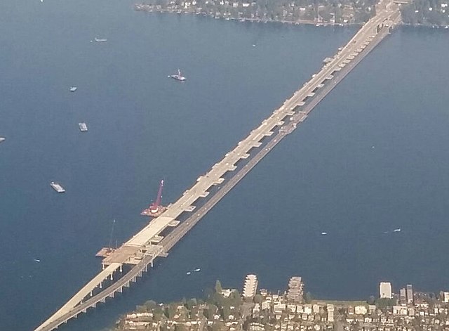 New (left) and old (right) bridges in 2015 showing difference in decks: old road surface is directly on pontoons laid end-to-end, but new road surface