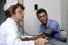 Assessing blood pressure Nurse checks blood pressure.jpg