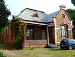 Nos 1 to 15 Artillery Street were built during the nineties of the nineteenth century by the Government of the old South African Republic as homes for officers and non-commissioned officers. These houses form a unique architectural series. Offisierswoning, 15 Artilleriery, Salvokop.jpg