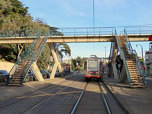 Outbound train at CCSF pedestrian bridge, January 2018.JPG