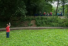 The engine is on the upper line in Northcliffe Woods, Shipley, West Yorkshire. The shorter raised loop is in the foreground. Oval track (lower), upper track with train.jpg