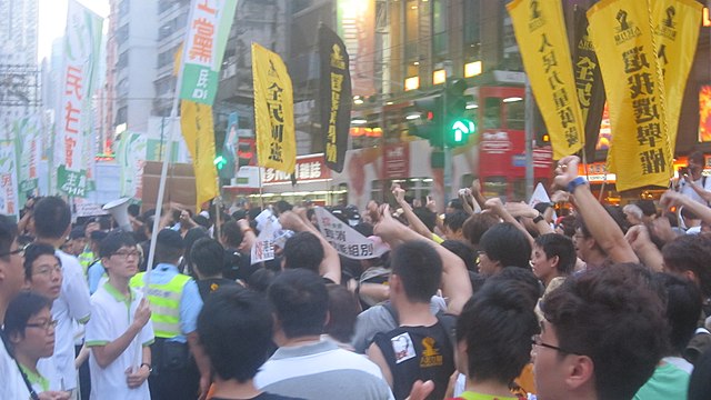 In 2011, members and supporters of People Power denounce the Democratic Party during the 1 July march