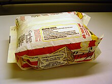 Microwave popcorn bags can contain residual PFOA from fluorotelomers. Popcorn bag popped.jpg