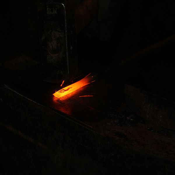 File:Red hot iron is forged with hammer and anvil.jpg