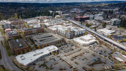 Aerial view of Downtown Redmond as seen from the southeast with several apartment buildings and an elevated trackway.