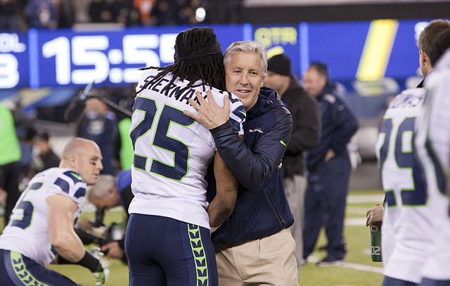 Sherman embracing Pete Carroll at Super Bowl XLVIII