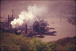 SMOKE EMITTED FROM A COKE PLANT OWNED BY THE UNITED STATES STEEL CORPORATION. IT IS LOCATED ALONG THE MONONGAHELA... - NARA - 557222.jpg