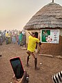 Sapashini pulling the gun trigger at a funeral in Northern Ghana 03