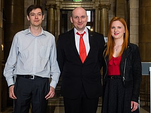 The current Skeptics with a K lineup: Michael "Marsh" Marshall, Mike Hall, and Alice Howarth, at the 2015 QED conference in Manchester. Skeptics with a K team at QED Question Explore Discover conference 2015.jpg