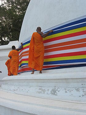 Buddhist bhikkus decorating the Somawathiya Chaitya Somawathiya Chethiya.jpg