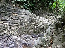 Basalt Columns exposed along a river in a remote place in Tawau, Malaysia Teck Guan Cocoa Village Columnar Basalt.jpg