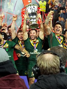 Tedesco lifting the RLWC trophy in 2022 Tedesco lifts 2021 RLWC.jpg