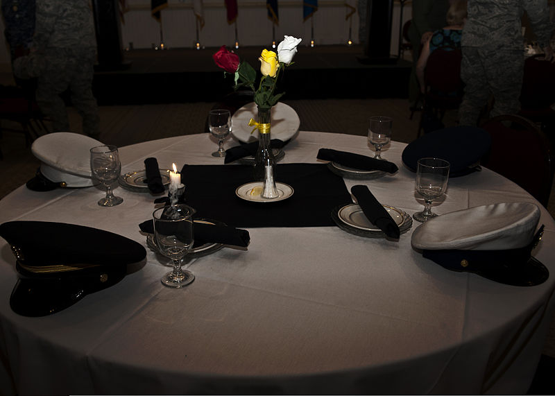 File:U.S. Navy, Air Force, Army, Marine Corps and Coast Guard service covers sit on a POW-MIA table as silent sentinels during the luncheon in honor of National POW-MIA Recognition Day at the Charleston Club 120921-F-FI292-020.jpg