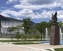 The Eagle and Fledglings Statue at the south end of the Air Gardens is inscribed with the quote, "Man's flight through life is sustained by the power of his knowledge". USAFA air gardens.jpg