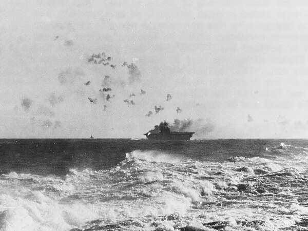 The aircraft carrier USS Enterprise (CV-6) under aerial attack during the Battle of the Eastern Solomons