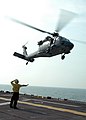 US Navy 050830-N-5561D-001 An MH-60S Seahawk helicopter takes off from the flight deck of the amphibious assault ship USS Bataan (LHD 5) to assist in search and rescue (SAR) missions in the New Orleans area.jpg