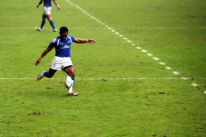 File:Uale Mai kicks rugby ball.jpg
