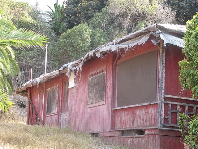 The side view of "Red Roost", a bungalow cottage built in 1894, one of two that still exist on the road above La Jolla Cove