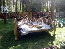 Tajik women playing a traditional guitar Prazdnik "Mekhrgon" v parke g. Dushanbe, 13.jpg