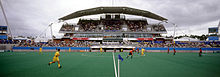 Panoramic view of the venue for football 7-a-side during the 2000 Summer Paralympics. A match can be seen played on field in front of the stadium. 151100 - Football Hockey venue view - 3b - 2000 Sydney venue photo.jpg