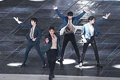 NU'EST performing on stage in 2017