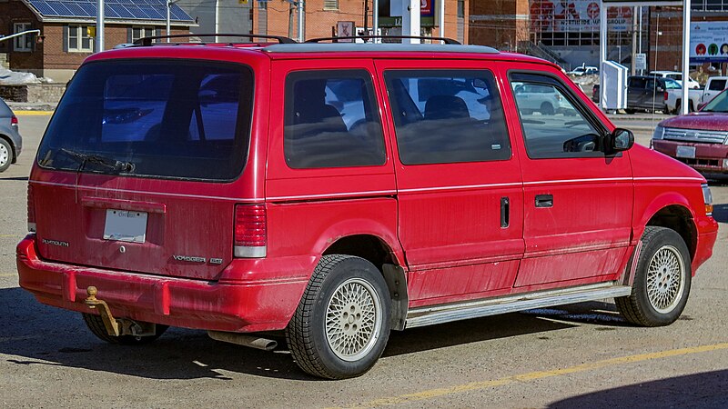 File:1995 Plymouth Voyager SE in Flame Red, Rear Right, 03-20-2023.jpg