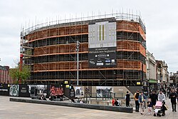 Scaffolding still up at 34-35 Whitefriargate in Kingston upon Hull. Since April, signage has now gone up advertising the planned works, and just visible in this photograph, the building has been stripped back to it's original brickwork.