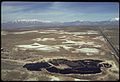 AERIAL VIEW OF A FIVE ACRE POND NEAR OGDEN, UTAH, THAT CONTAINED ACID WATER, OIL, ACID CLAY SLUDGE, CARS, DEAD... - NARA - 555845.jpg