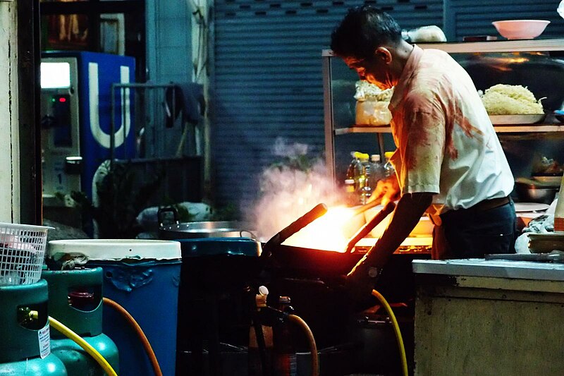 File:A man cooking with a wok in Bangkok.jpg