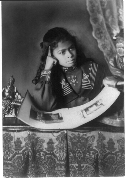 File:African American girl, half-length portrait, with right hand to cheek, with illustrated book on table LCCN99472366.tif