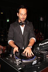 Dimitriades DJing at an event in 2012 Alex Dimitriades (7176090638).jpg