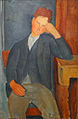 Pintura italiana de um menino com o cotovelo esquerdo sobre uma mesa, cabeça na mão