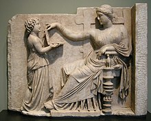 Geoffrey Hosking suggests that fear of being enslaved was a central motivating force for the development of the Greek sense of citizenship. Sculpture: a Greek woman being served by a slave-child. Arte greca, pietra tombale di donna con la sua assistente, 100 ac. circa.JPG