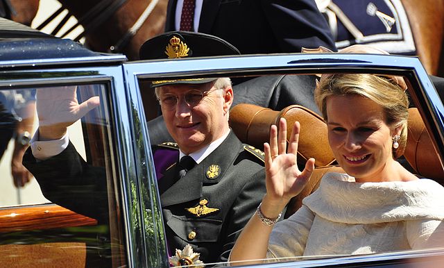 King Philippe and Queen Mathilde wave to crowds in Brussels after his swearing in as the new Belgian monarch.