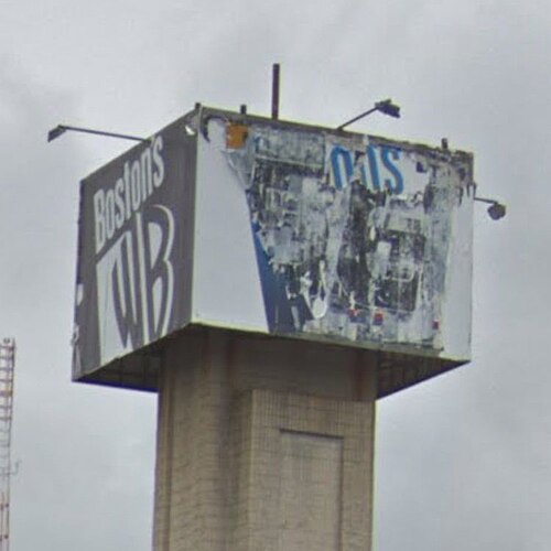 The "Boston's WB" logo remains visible, though beaten by the elements, on a pylon at the former Morrissey Boulevard studios of WLVI in this 2019 photo