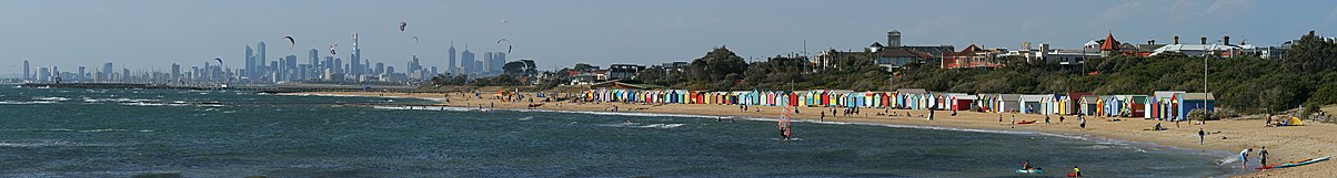 The Brighton Bathing Boxes with the Middle Brighton pier and breakwater, and the city skyline in the background Brighton Beach, Vic Pano, 10.01.2009.jpg