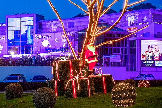 santa claus with gifts in front of a shopping center in Ibach, Switzerland