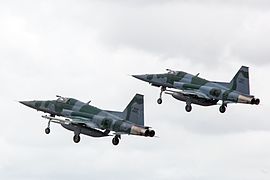 Two F-5M fighters taking off in aerial alert