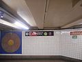 A modern Helvetica sign directing commuters to the G train on the IND Crosstown Line, or the 7 train on the IRT Flushing Line.