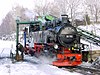 A Fichtelbergbahn locomotive taking on water at Cranzahl station in February 2003