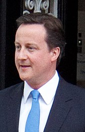 Conservative leader David Cameron seen leaving St Stephen's Club on the afternoon of 7 May 2010, the day his party began negotiations with the Liberal Democrats to form a government. David Cameron St Stephen's Club 2 cropped.jpg