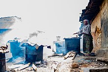 Processing fish while being exposed to smoke Fish processing hub.jpg