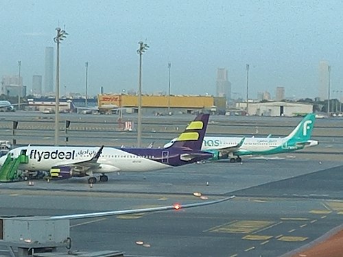 Flyadeal Airlines and Flynas Airlines in the same frame in King Abdulaziz International Airport