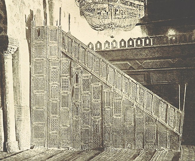 The minbar of the Great Mosque of Kairouan in Kairouan, Tunisia, the oldest minbar in existence, still in its original location in the prayer hall of the mosque. (Photograph from the 19th century, before a modern protective glass barrier was installed)